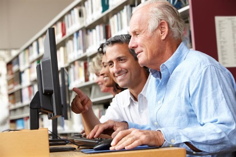 Seniors using computer in library.jpg